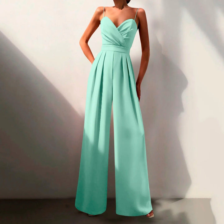 Combinaison estivale fluide, élégante.  Coupe ample, décolleté croisé, taille cintrée.  Parfait pour l'été.