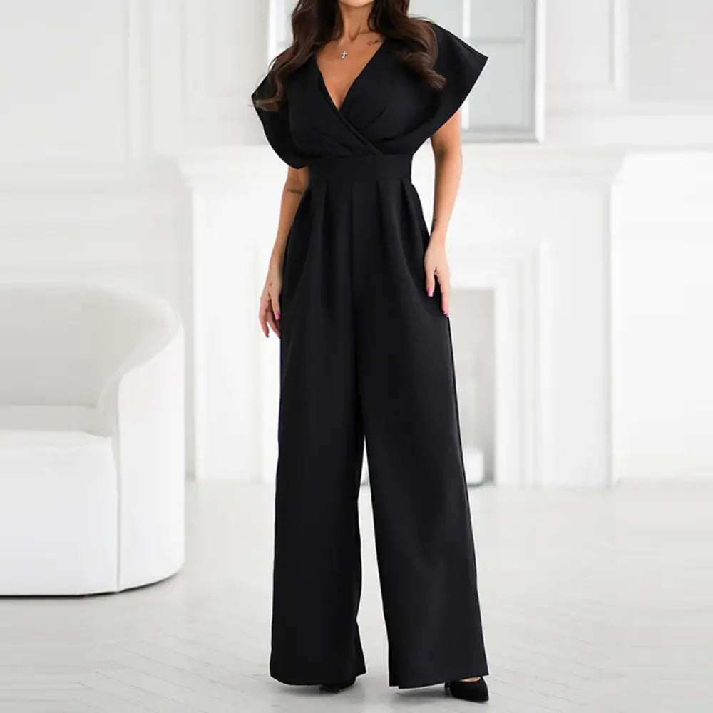 "Combinaison femme élégante large, manches papillon, tissu fluide, couleur sobre, jambes larges, taille cintrée, soirée chic"