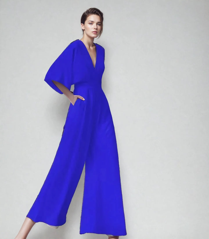 Jumpsuit femme élégante, manches papillon, décolleté V. Combinaison fluide jambes larges pour cérémonie.