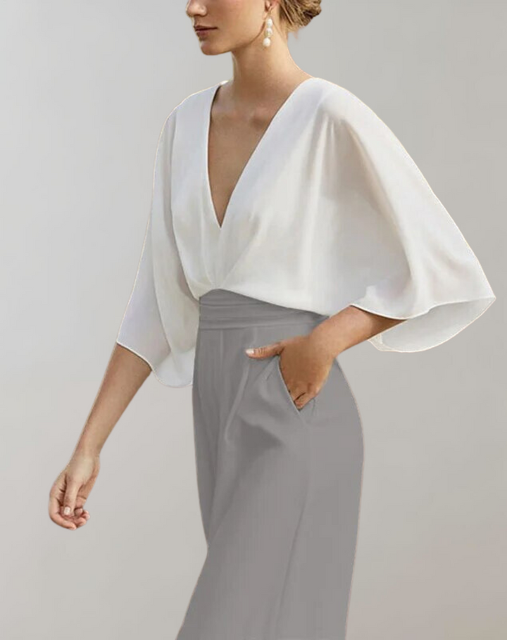 Combinaison fluide femme, manches papillon, coupe élégante et confortable.  Idéale pour occasions spéciales.