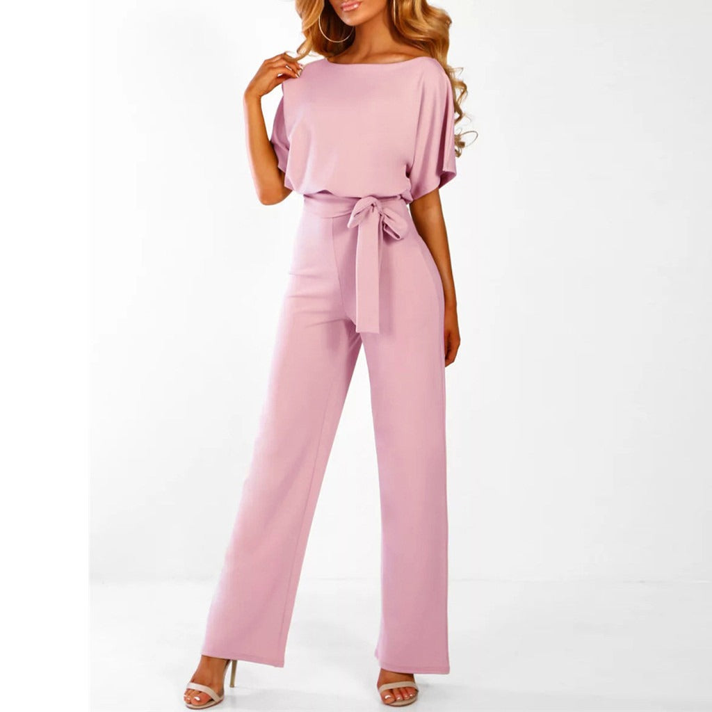 Combinaison femme à jambes larges, taille ajustable, style raffiné. Idéale pour un look élégant.