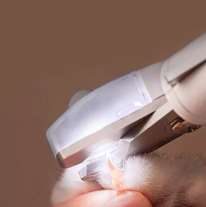 Coupe-griffes électronique pour chien et chat. Soin précis et doux des griffes.  Coupe facile et rapide.