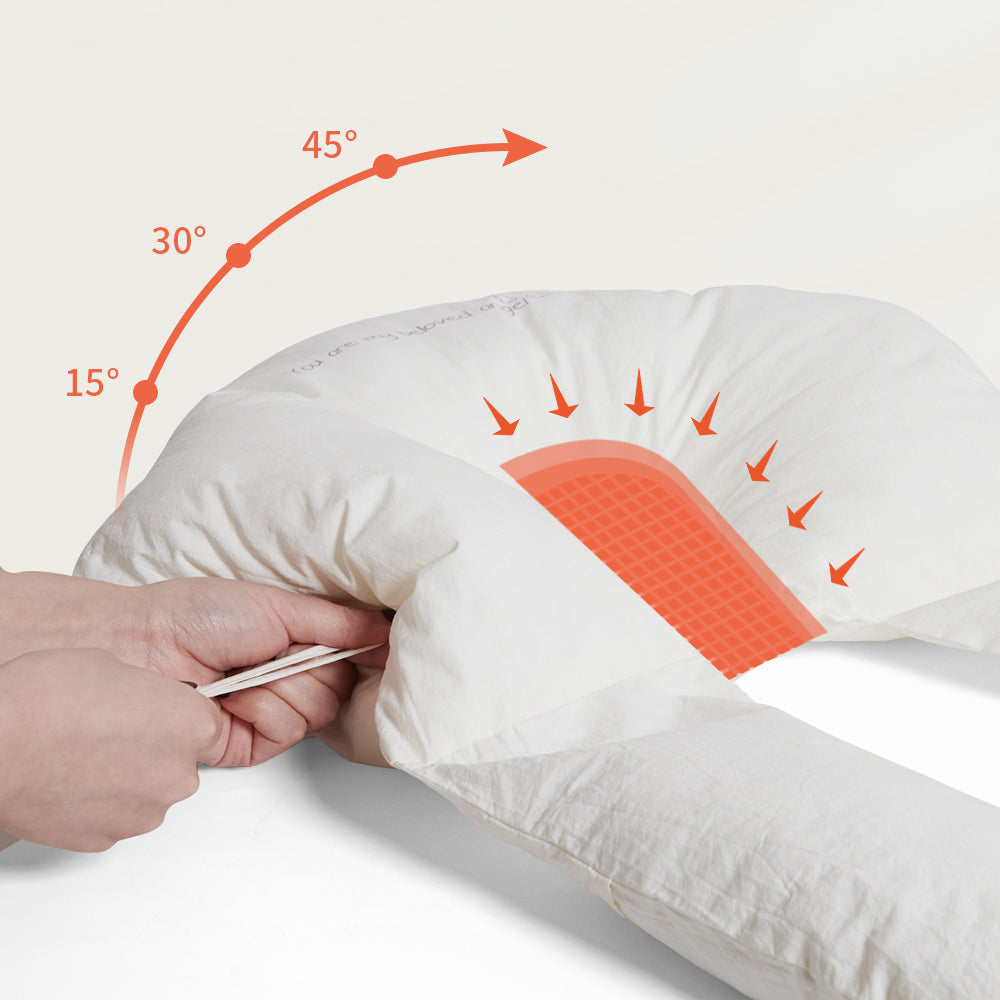 Coussin bébé apaisant dans un lit, pour un sommeil sécurisé et un confort optimal du nouveau-né.
