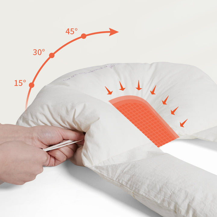 Coussin bébé apaisant dans un lit, pour un sommeil sécurisé et un confort optimal du nouveau-né.