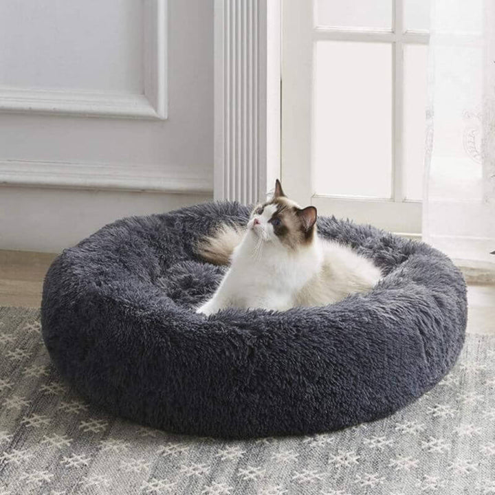 Coussin moelleux anti-stress pour chat.  Confort optimal, design ergonomique. Plusieurs tailles et couleurs.