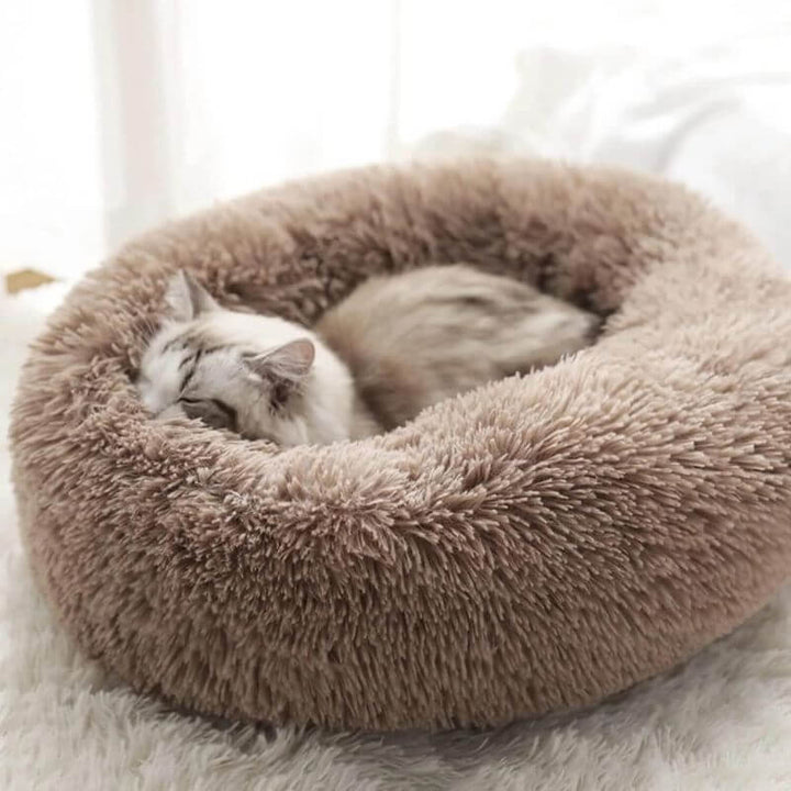 Coussin moelleux anti-stress pour chat.  Confort optimal, design ergonomique. Plusieurs tailles et couleurs.
