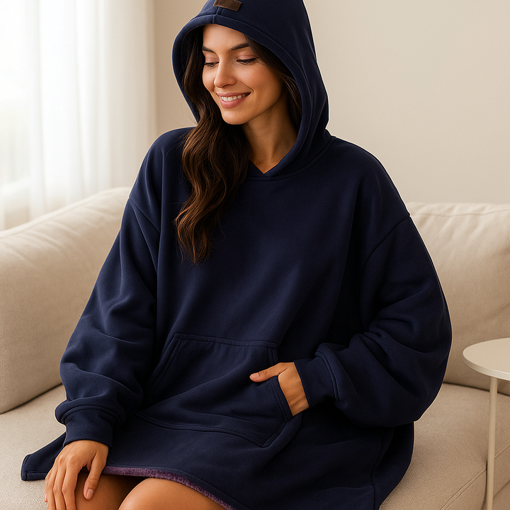 Plaid cocooning pour femme avec capuche, en polaire douce pour des moments de pure détente et chaleur hivernale.