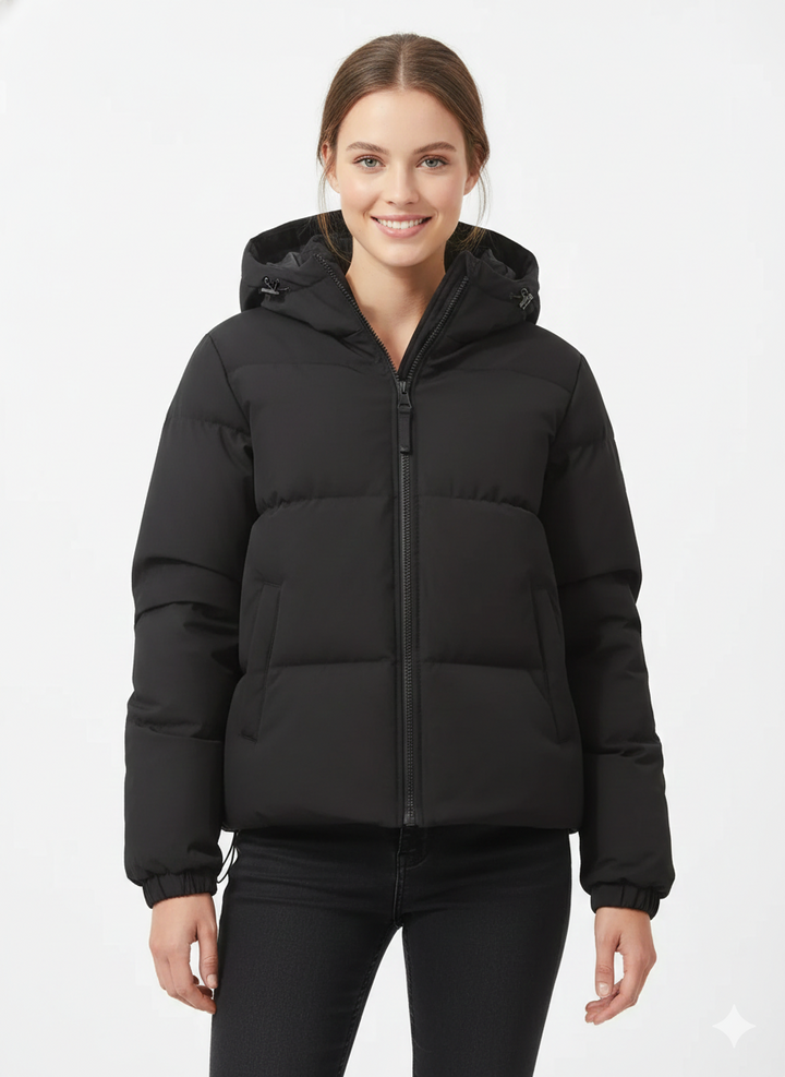 Détail de la doudoune femme : fermeture éclair robuste. Manteau léger à capuche, chaud et pratique pour l'hiver.