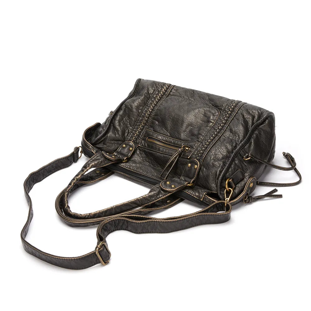 "Élégant sac à main noir en cuir véritable, chic et durable, idéal pour femmes, avec fermeture éclair et multiples compartime