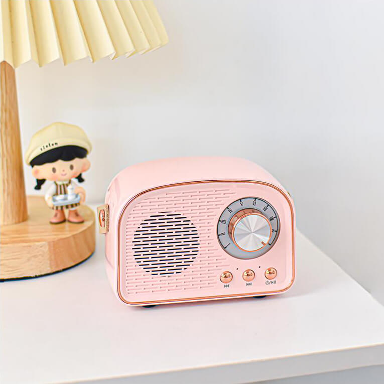 Enceinte Bluetooth vintage, son rétro, radio FM intégrée. Design compact et élégant.