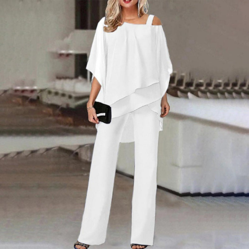 Tenue 2 pièces chic pour femme, idéale pour cérémonie ou événement spécial. Ensemble élégant pantalon et top.