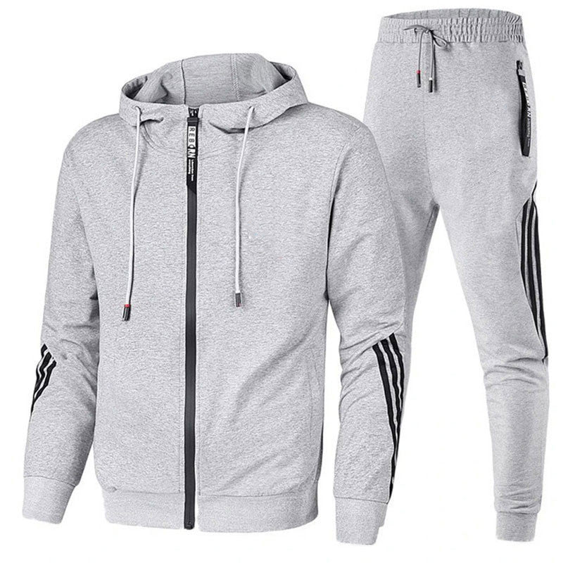 "Ensemble de survêtement homme gris, coupe ergonomique, matériau respirant idéal sport et loisirs, confort et style modernes.