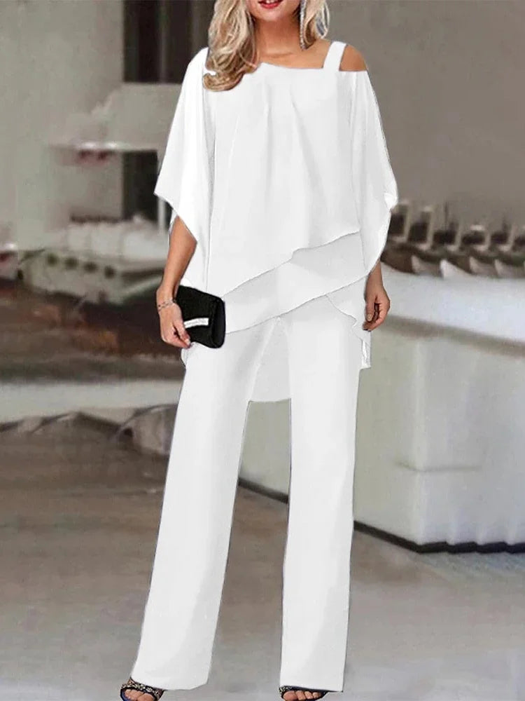 Ensemble élégant femme, haut manches chauve-souris, coupe épurée, coloris blanc, bleu, noir, rouge, style chic et confortable
