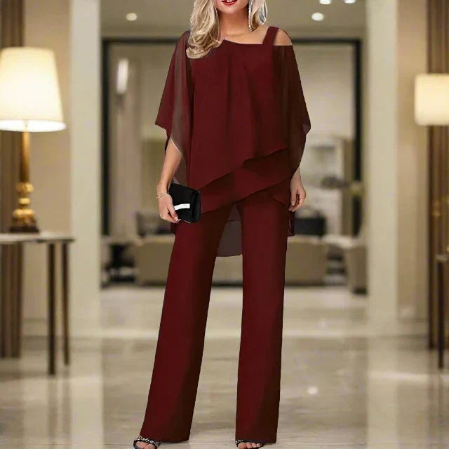 Vêtement élégant femme: ensemble chic jumpsuit & blouse asymétrique, parfait pour mariages et cocktails.