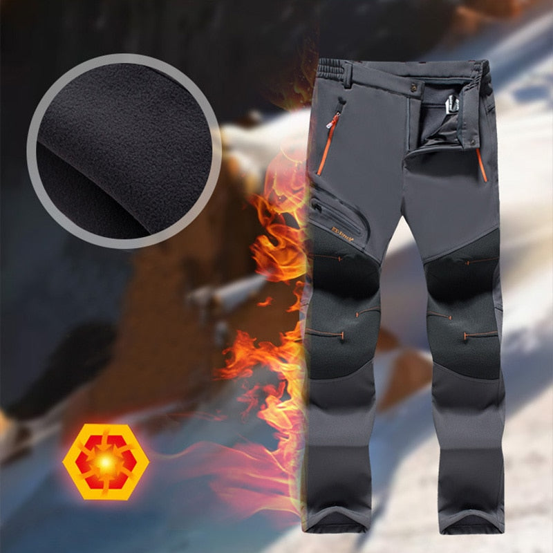 Tenue hivernale homme, veste et pantalon chaud, imperméable pour le trekking et la randonnée.