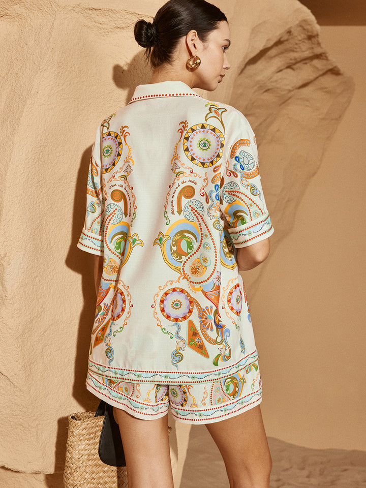 "Ensemble polo imprimé femme, beige élégant, manches courtes, short assorti, confort décontracté et haute qualité, vue avant.