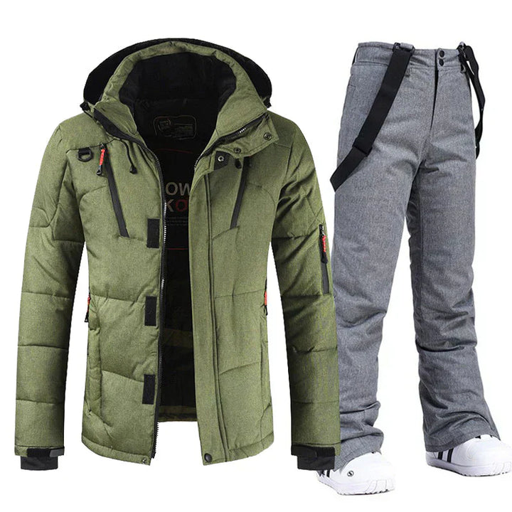 "Ensemble ski homme imperméable, veste bleu e pantalon noir coupe-vent, parfait pour activités extérieures hivernales"
