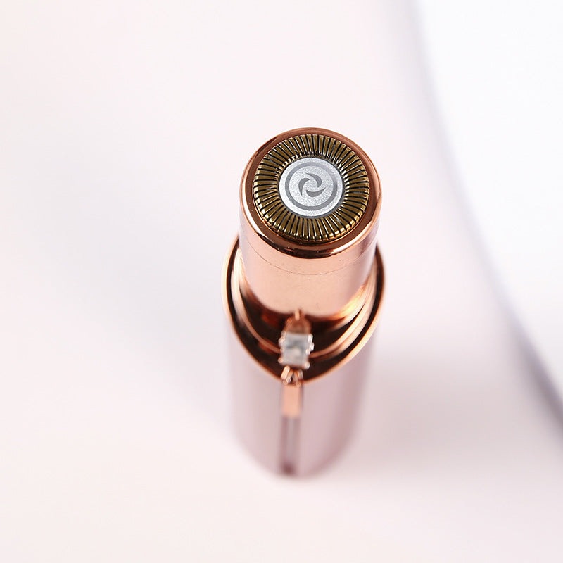 "Épilateur facial portable élégant, compact, idéal pour une peau lisse et douce; accessoire essentiel pour femmes."