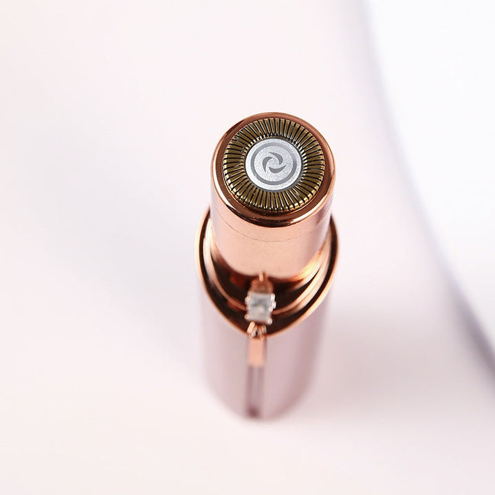 "Épilateur facial portable élégant, compact, idéal pour une peau lisse et douce; accessoire essentiel pour femmes."