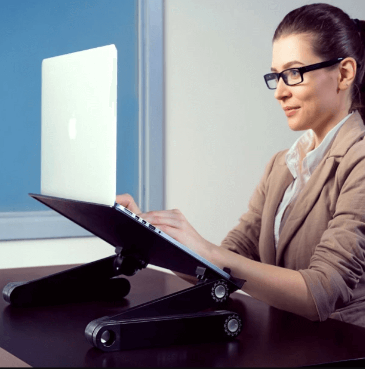 Ergonomic laptop stand, 360° adjustable, improves posture & comfort.  Lightweight, foldable design with ventilation.