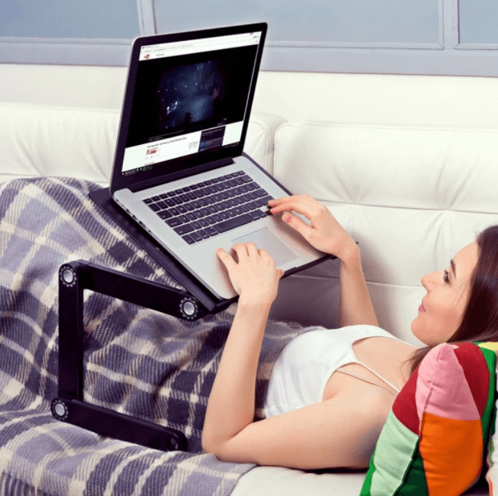 Ergonomic laptop stand, 360° adjustable, improves posture & comfort.  Lightweight, foldable design with ventilation.