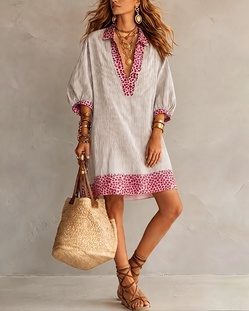 Robe élégante femme, mélange léopard et rayures, manches bouffantes, col chemise, mode estivale fluide.