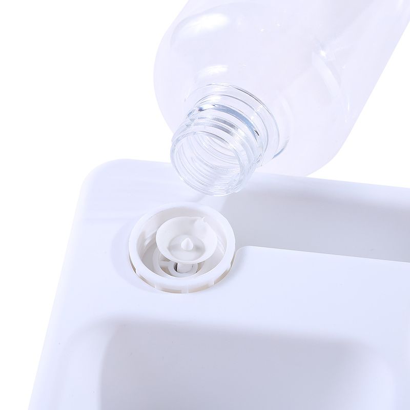 Fontaine à eau chat 500ml, sans électricité. Design moderne et compact, système 2-en-1 pour eau et nourriture.