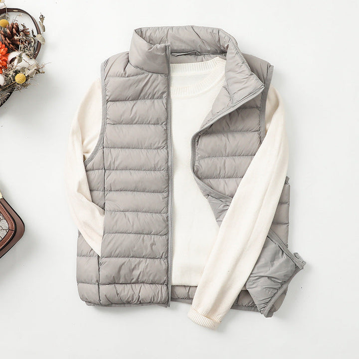 Gilet doudoune femme noir léger, matelassé, sans manches, idéal toutes saisons, style casual élégant.