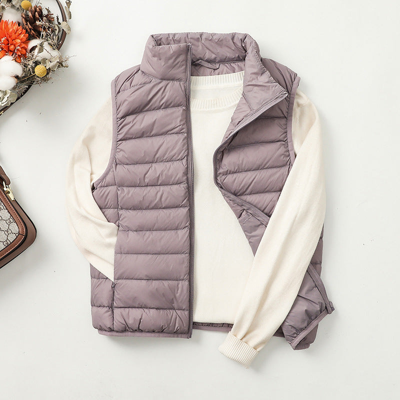 Gilet doudoune femme versatile, coupe moderne, matelassé, idéal pour une superposition facile.