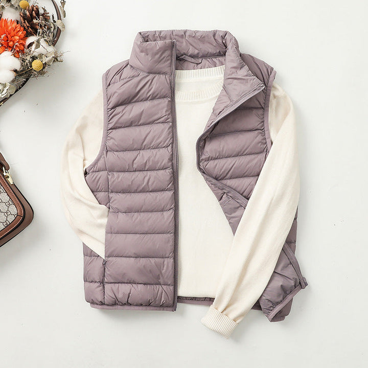 Gilet doudoune femme versatile, coupe moderne, matelassé, idéal pour une superposition facile.