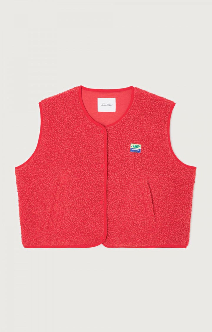 Style gilet femme sans manches boutonné, pièce maîtresse pour un dressing féminin.