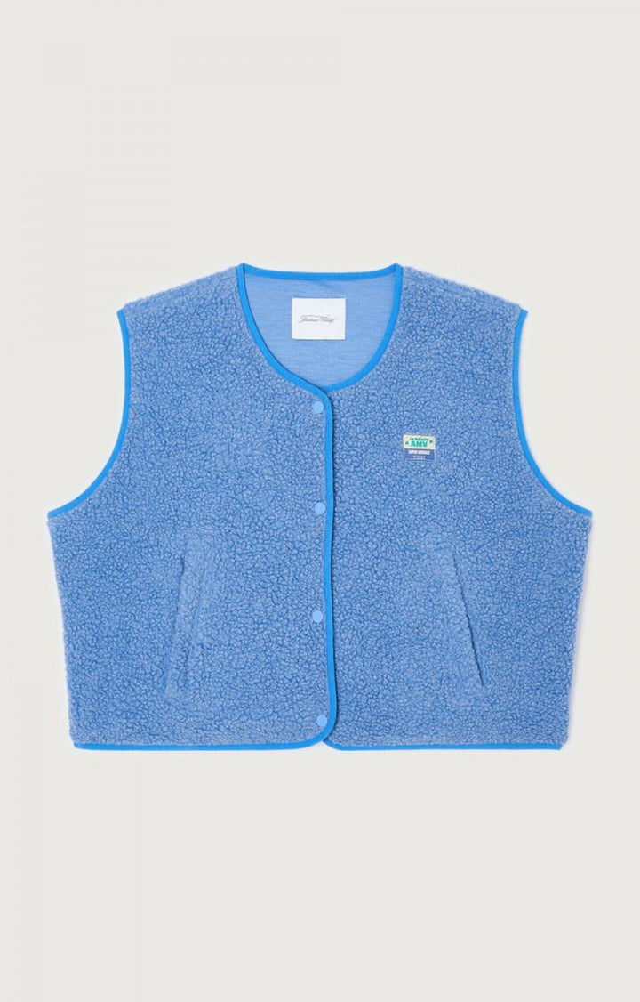 Gilet femme sans manches boutonné, polyvalent et chic, pour un style mode automne-hiver réussi.