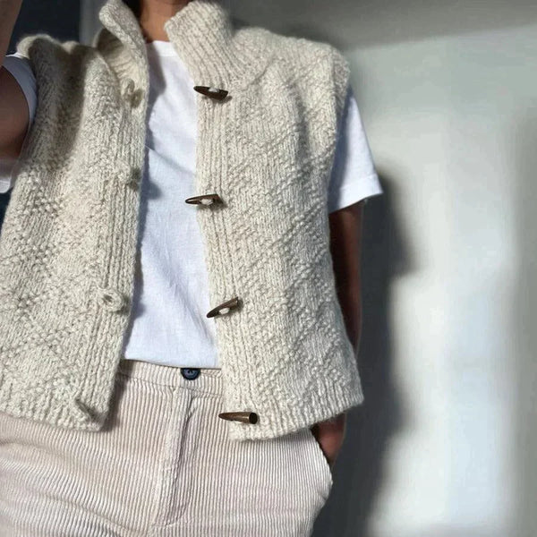Gilet sans manches élégant crème pour femme, style automne-printemps chic. Parfait pour une tenue décontractée et polyvalente.