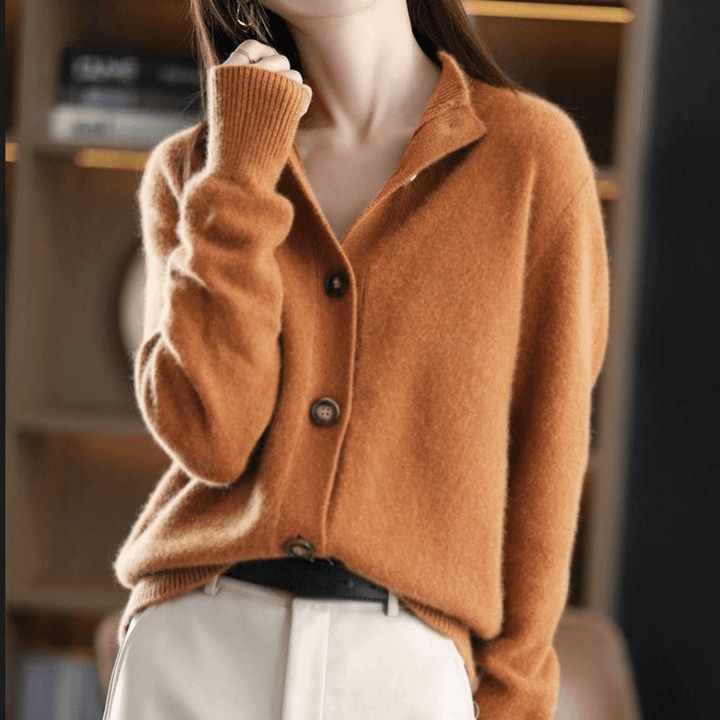 Haut femme douillet et élégant, ce gilet tricoté offre chaleur et style pour l'automne-hiver.