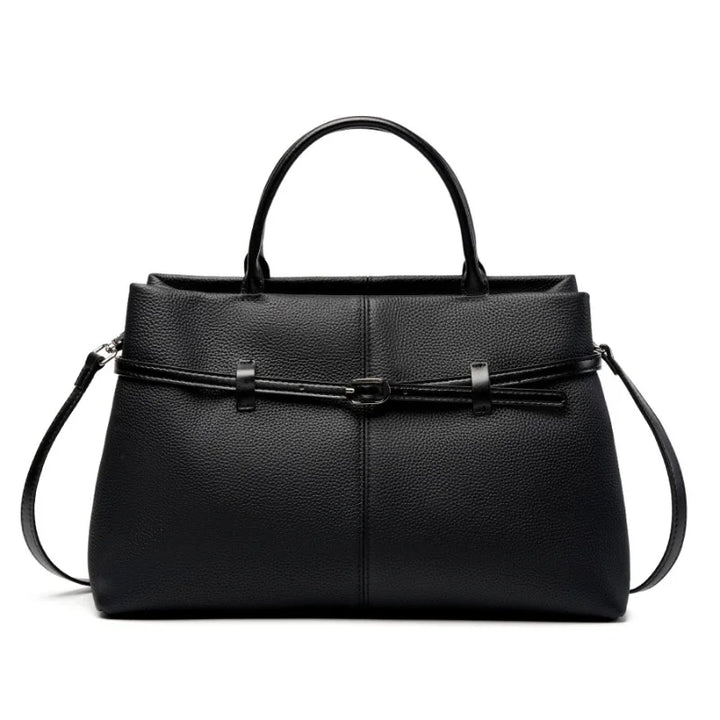 Sac cabas en cuir grainé rose poudré, élégant et féminin, avec une grande capacité de rangement.