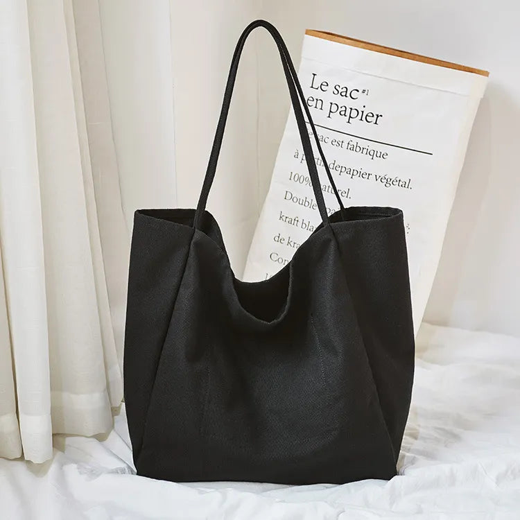 Sac journalier en tissu, grand cabas polyvalent pour femmes, accessoire de mode durable et spacieux.