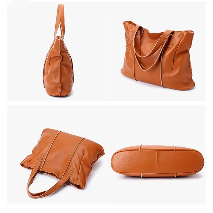 Sac cabas femme en cuir souple noir, avec anses solides, supportant un poids important pour un usage intensif.