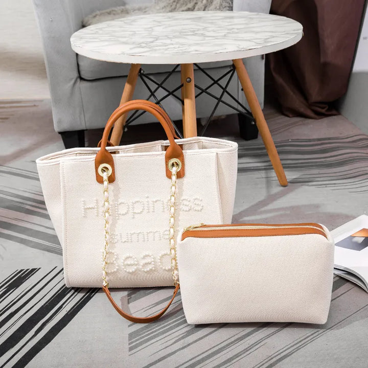 Élégant grand sac cabas femme en toile crème, brodé de perles. Sac d'épaule fourre-tout tendance et chic.