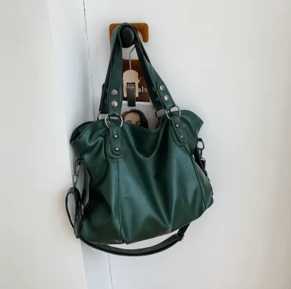 Anses solides d'un sac cabas femme en cuir PU noir, confortables à porter.