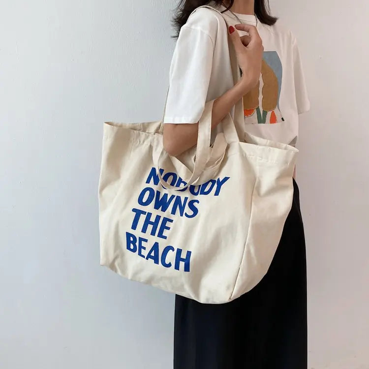 Grand sac de plage blanc en toile pour femme, idéal pour les vacances d'été