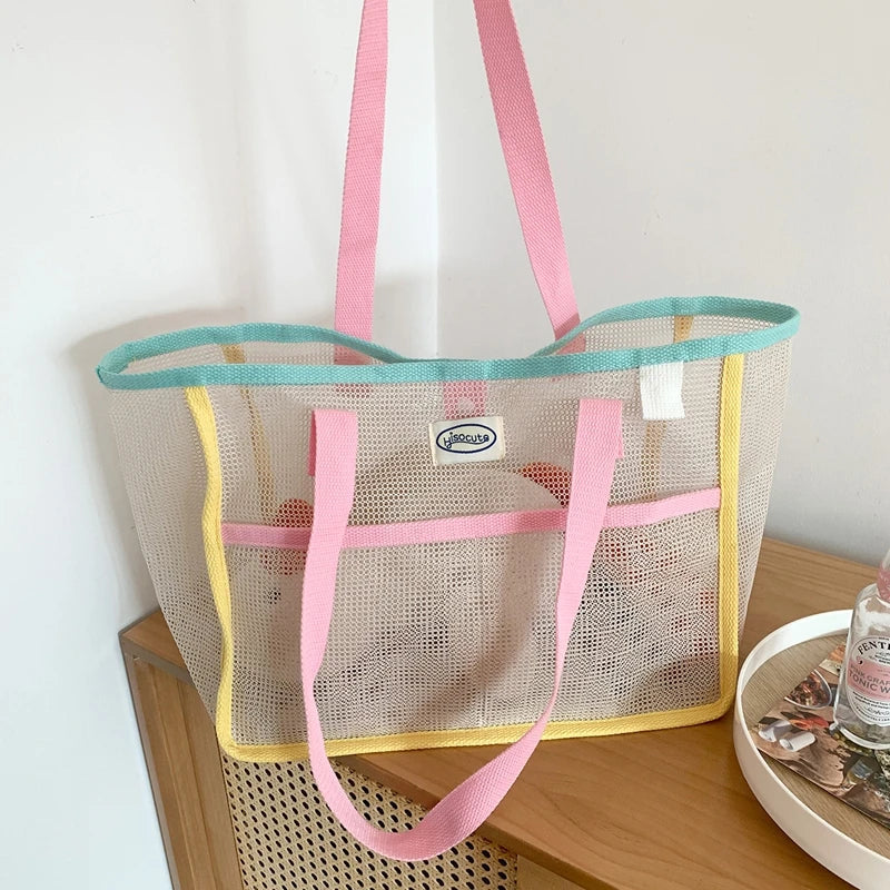 Grand sac de plage cabas rose tendance pour femmes, léger et pratique, idéal pour l'été et les vacances.