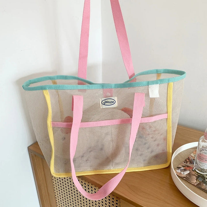 Grand sac de plage cabas rose tendance pour femmes, léger et pratique, idéal pour l'été et les vacances.