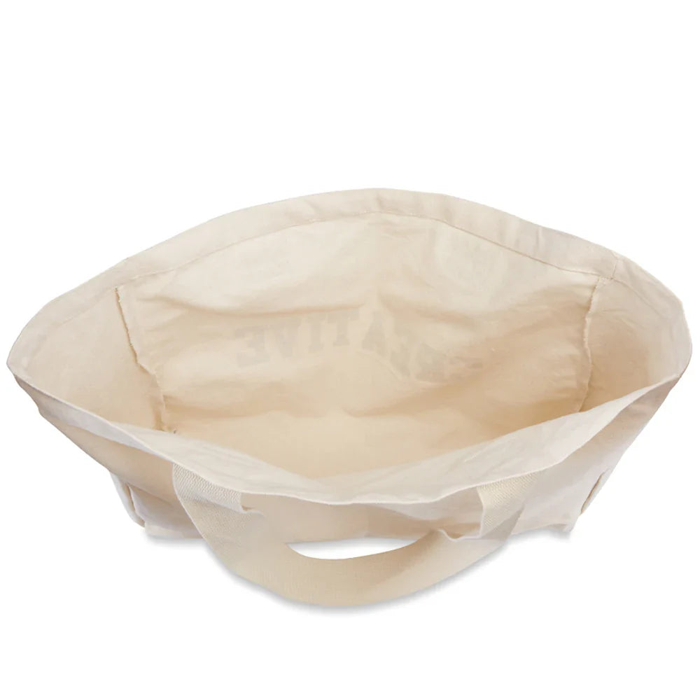 Sac de plage lavable grand format en tissu crème pour femme, un essentiel de l'été.