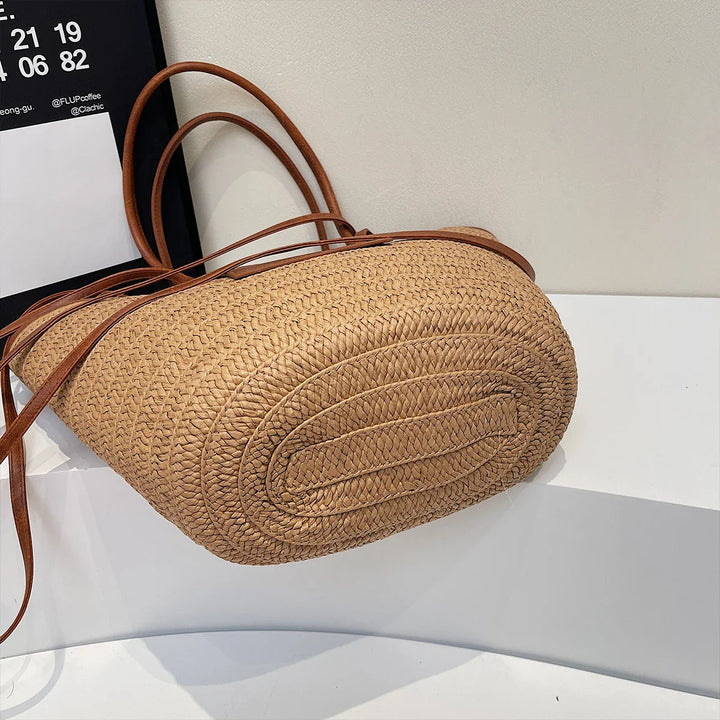 Sac cabas Simona beige, grand format, en paille robuste avec intérieur doublé pour la plage ou la ville.