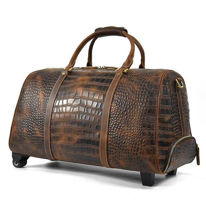 Sac de voyage homme avec roulettes intégrées. Cuir crocodile. Facile à manœuvrer. Gain de temps.