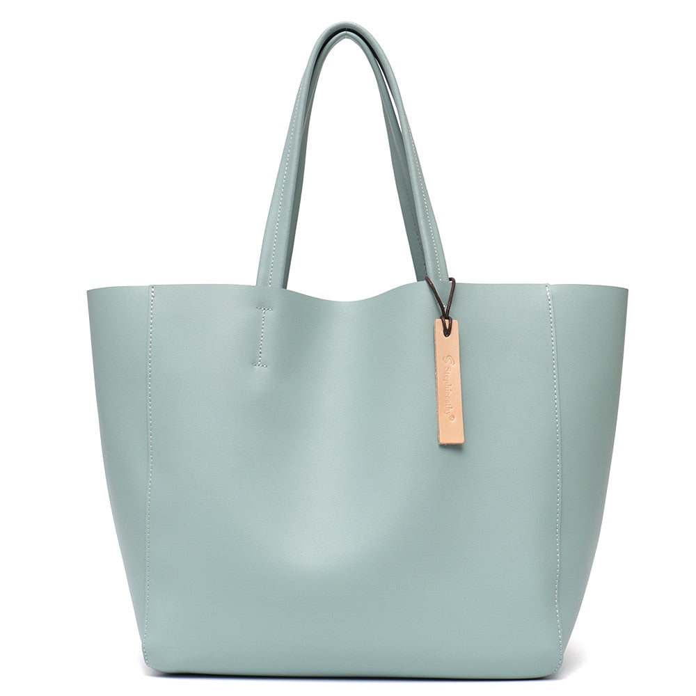 Grand sac à main femme, couleur neutre, en cuir véritable, s'adaptant à toute tenue.