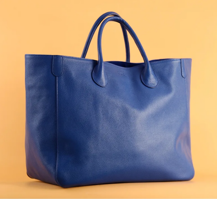 Sac fourre-tout en cuir bleu pour femme, parfait pour un usage quotidien, alliant élégance et praticité.