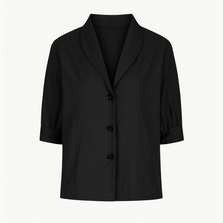 Top femme fluide noir à manches courtes, parfait pour un style mode décontracté et élégant.