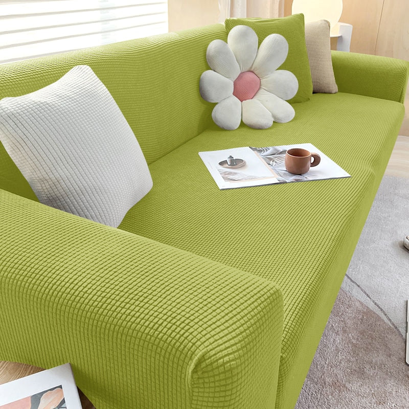 Housse de canapé extensible beige avec motif élégant et design antidérapant, disponible en plusieurs tailles pour salons mode