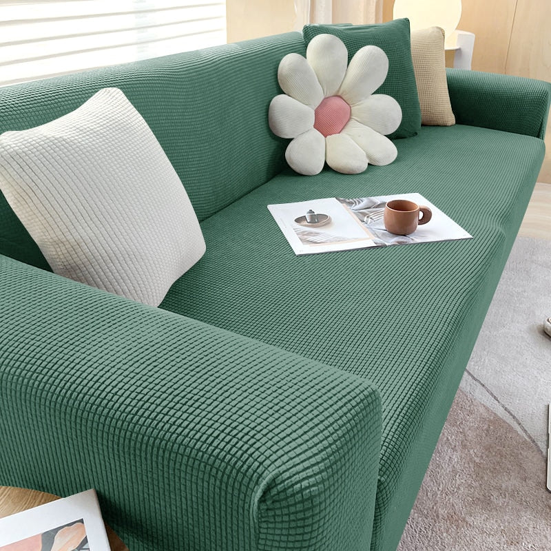 Housse de canapé extensible beige avec motif élégant et design antidérapant, disponible en plusieurs tailles pour salons mode